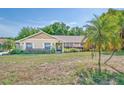 Welcoming home with a charming front yard and inviting curb appeal at 11763 Oswalt Rd, Clermont, FL 34711