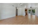 Open-concept space featuring light hardwood floors, neutral walls, and natural light at 11987 Se 95Th Ter, Belleview, FL 34420