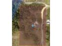 An aerial view showcasing the property's boundaries, mature trees, home and natural surroundings at 1425 Douglas Rd, Groveland, FL 34736