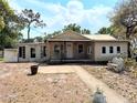 Charming single-story home with a welcoming front porch and landscaped front yard at 1425 Douglas Rd, Groveland, FL 34736