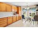 Well-lit kitchen nook with lovely window views, bright cabinetry, and modern finishes at 1561 Loris Loop, The Villages, FL 32162