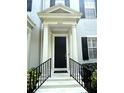 Inviting front door with stately columns and well-maintained landscaping. Address 2261 clearly visible at 2261 Osprey Ave, Orlando, FL 32814