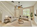 Welcoming living room featuring soaring ceilings, a ceiling fan, and ample natural light at 3275 Oak Brook Ln, Eustis, FL 32736