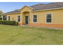 A quaint home exterior features a covered entrance and neatly trimmed shrubs at 3656 Solana Cir # A, Clermont, FL 34711