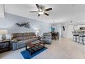 Spacious living room with neutral tones, plush seating, and stylish decor at 5300 S Atlantic Ave # 16-202, New Smyrna Beach, FL 32169