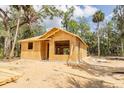 Framing stage of a new home construction showcasing the structure and layout on a sunny day at Lot 43 Indian Estates Cr 423, Lake Panasoffkee, FL 33538