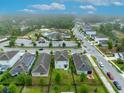 Beautiful aerial view of a residential neighborhood with a community pool and recreation center nearby at 113 Camilla Rd, Deland, FL 32724