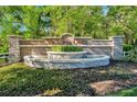 Victoria Oaks sign with a brick water feature and greenery, marking the entrance to a well-maintained community at 113 Camilla Rd, Deland, FL 32724