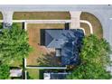 Birds-eye view of home showing a neatly fenced-in yard with mature trees, creating a private and inviting outdoor space at 1313 Lake Idamere Blvd, Tavares, FL 32778