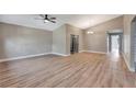 Vaulted ceilings and fan highlight this open living space with modern vinyl plank flooring at 1566 Lawndale Cir, Winter Park, FL 32792