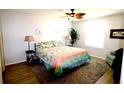 Cozy bedroom with a queen-size bed, soft rug, and ample natural light from the window at 1650 Duran Dr, The Villages, FL 32162