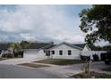 Charming single-story home with a well-maintained lawn, attached garage, and mailbox at 2600 Pisces Dr, Orlando, FL 32837