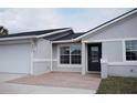 Charming single-story home featuring an attached garage, well-kept lawn and inviting entryway at 2600 Pisces Dr, Orlando, FL 32837