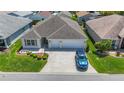 Aerial view of the residence highlighting the layout, landscaping, and neighborhood setting at 2992 Hicks Pl, The Villages, FL 32163