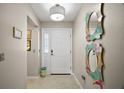 Welcoming entryway with stylish decor, tiled floor, and plenty of natural light at 419 Aldama Ave, The Villages, FL 32159