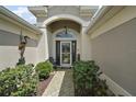 Inviting front entrance with well-maintained landscaping and a welcoming door at 685 Winifred Way, The Villages, FL 32162