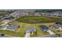 Expansive aerial view of the neighborhood showcasing the home's location within a large community at 1422 Jeremy Cir, The Villages, FL 34762