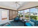 Cozy sunroom with comfortable seating, ceiling fan, and lots of natural light at 1706 Moreno Pl, The Villages, FL 32159