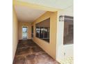 Enclosed patio with concrete floors, screens, and natural light at 2037 Lakeshore Dr, Mount Dora, FL 32757