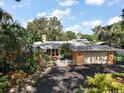Lovely one-story home featuring an attached two-car garage and a well-manicured lawn at 2121 Suzanne Dr, Mount Dora, FL 32757