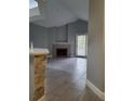 Living room featuring a fireplace, vaulted ceilings, and sliding glass doors to the exterior at 234 Afton Sq # 305, Altamonte Springs, FL 32714
