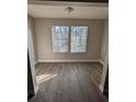 Sun-filled room with attractive new laminate floors, neutral walls, white trim, and sunny windows with blinds at 236 Afton Sq # 309, Altamonte Springs, FL 32714