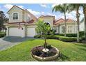 Charming home with well-maintained lawn and decorative landscaping in a desirable neighborhood at 2497 Heritage Green Ave, Davenport, FL 33837