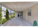 Spacious carport area with a view of the lake, ideal for outdoor activities at 25 Captains Pt, Fruitland Park, FL 34731