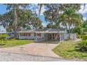 Charming single-story home with driveway and cozy front porch at 2529 Cr 448, Lake Panasoffkee, FL 33538