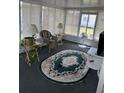 Inviting sunroom filled with natural light and comfortable seating, perfect for relaxation and enjoyment at 313 Palo Verde Dr, Leesburg, FL 34748