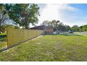 Large, newly fenced backyard, providing privacy and a sense of seclusion at 316 Betty Ln, Mascotte, FL 34753