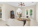 Inviting living space with tile flooring, comfortable seating, and ample natural light at 33222 Irongate Dr, Leesburg, FL 34788