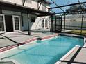 Outdoor pool with a screened-in patio area, perfect for relaxation and entertainment at 33710 Linda Ln, Leesburg, FL 34748
