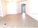 Bright and spacious living room with ample natural light and neutral finishes at 3942 Zenith Loop, The Villages, FL 32163