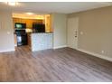 Open-concept living room flows into an updated kitchen with modern finishes at 420 Forestway Cir # 306, Altamonte Springs, FL 32701