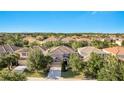 Stunning aerial view of the home nestled within a lush green neighborhood, showcasing its prime location at 4328 Acorn Ct, Davenport, FL 33837