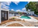 Inviting backyard pool area with a brick-paved patio, perfect for relaxing and entertaining guests at 8198 Se 164Th Pl, Summerfield, FL 34491