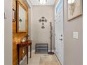 Welcoming entryway featuring decor, neutral walls, and a white front door offering a tidy first impression at 17519 Promenade Dr, Clermont, FL 34711