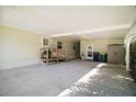 Spacious covered carport area with access to the home, providing ample parking and storage solutions at 3209 Manatee Rd, Tavares, FL 32778