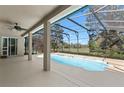 Inviting pool offers both recreation and relaxation, with a view of the backyard at 5138 Rishley Run Way, Mount Dora, FL 32757