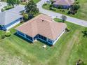 An aerial view of the back of a home with a screened-in lanai overlooking the lawn at 11702 Se 173Rd Lane Rd, Summerfield, FL 34491
