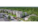 Beautiful aerial view of a multi-Gathering property with mature landscaping, in a wooded area at 2310 Silver Palm Dr # 301, Kissimmee, FL 34747