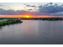 Breathtaking sunset view over the lake, reflecting vibrant colors on the calm water at 3011 Lake Woodward Dr, Eustis, FL 32726