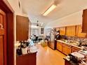 Kitchen with light wood cabinets, a breakfast nook and stainless steel appliances at 3051 Newmark Dr, Deltona, FL 32738