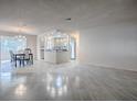 Open living space features tile flooring and recessed lighting, creating a bright and airy atmosphere at 507 Torres Pl, The Villages, FL 32159