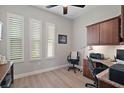 Bright office space with ample natural light, built-in storage, and contemporary furnishings at 5195 Greens Dr, Lady Lake, FL 32159
