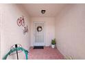 Inviting front porch with a decorative wreath, adding charm to the entrance and curb appeal to the home at 623 Delgado Ave, The Villages, FL 32159