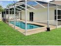Inviting screened-in pool area with ample space for lounging and entertaining at 685 Reindeer Dr, Kissimmee, FL 34759