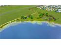 Beautiful aerial view of waterfront land, showcasing lake access and acreage at 9510 Suggs Rd, Clermont, FL 34711