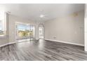 Bright living area features sliding glass doors to the lanai and neutral paint throughout at 11780 Se 178Th St, Summerfield, FL 34491